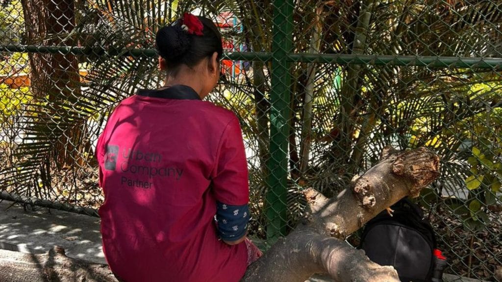 A Snabbit worker waits near a park between assignments. Manisha Mondal | ThePrint