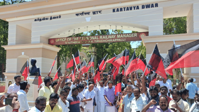 DMK leaders and workers protested the Hindi sign at the entrance of the Tiruchirappalli divisional railway office on Wednesday | By Special Arrangement