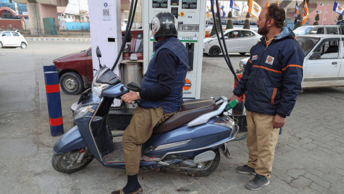 A customer refills at a gas station in Srinagar, Jammu and Kashmir, on March 4.Photographer: Firdous Nazir/NurPhoto/Getty Images
