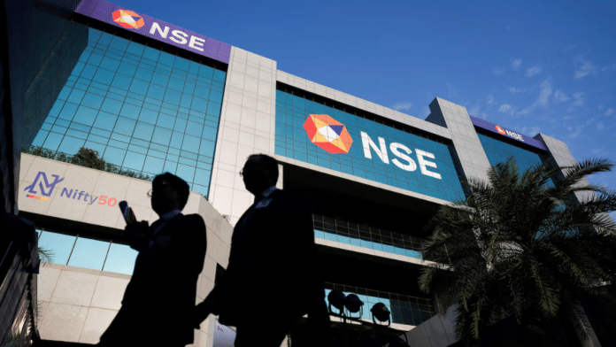 People walk outside the National Stock Exchange (NSE) in Mumbai, India, October 22, 2024. | REUTERS/Francis Mascarenhas