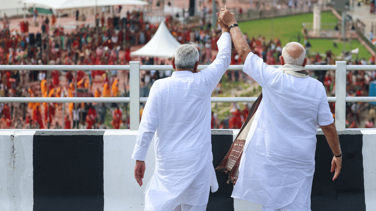 In this 31 December 2025 photo, PM Modi & CM Nitish Kumar wave at enthusiastic crowd at the inauguration of Aunta-Simaria Bridge in Begusarai, | Narendra Modi Photo Gallery/ANI Photo
