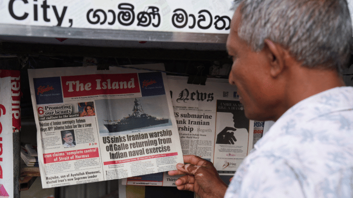 A man checks the local newspaper, follwoing a submarine attack on IRIS Dena off the coast of Sri Lanka, in Galle, Sri Lanka, 5 March. | Reuters/Thilina Kaluthotage