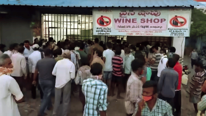 Representational image. | People outside a liquor shop in Visakhapatnam. | ANI