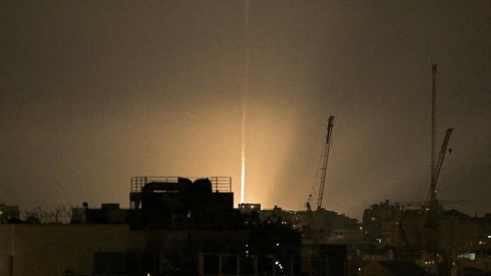 The sky is illuminated as an Iranian missile lands in Israel, amid the U.S.-Israeli conflict with Iran | Reuters/Dylan Martinez