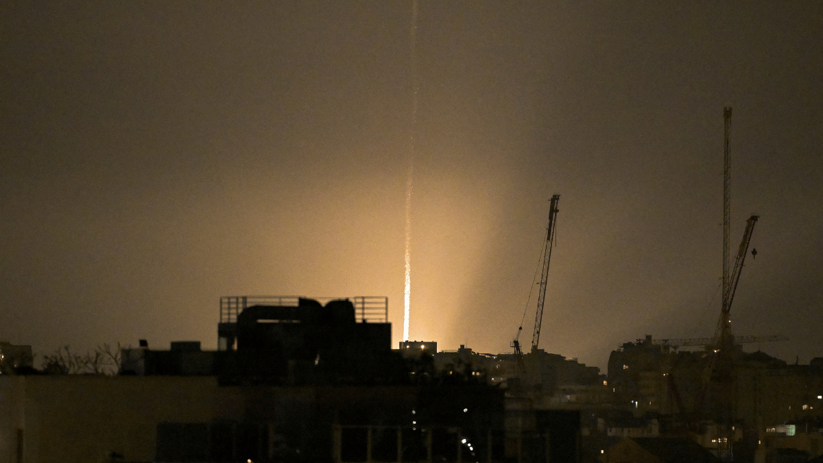 The sky is illuminated as an Iranian missile lands in Israel, amid the U.S.-Israeli conflict with Iran | Reuters/Dylan Martinez