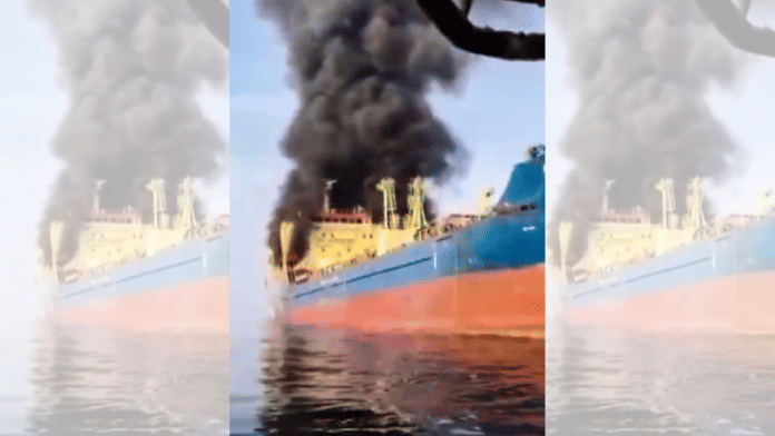 Smoke billows from a Palau-flagged oil tanker with 15 Indian crew members after it came under attack from the Iranian military off Oman's Musandam peninsula. | Handout via PTI