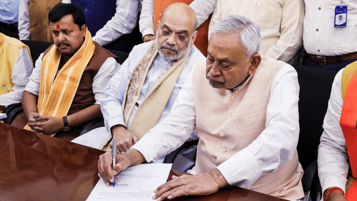 Bihar Chief Minister Nitish Kumar files his nomination for Rajya Sabha polls in the presence of Union Home Minister Amit Shah and BJP National President Nitin Nabin, in Patna, Thursday | Photo: PTI