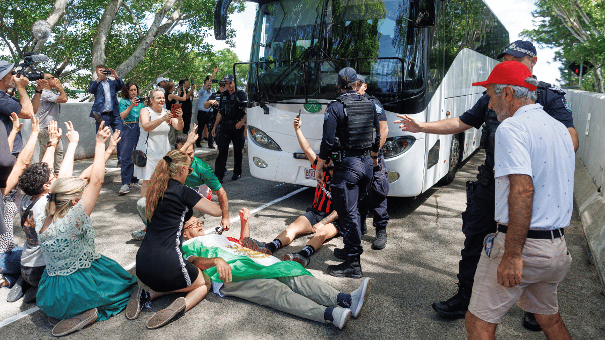 Protesters block the progress of a bus believed to be carrying the Iranian women's football team as it attempts to leave a hotel on the Gold Coast, Australia | AP via PTI