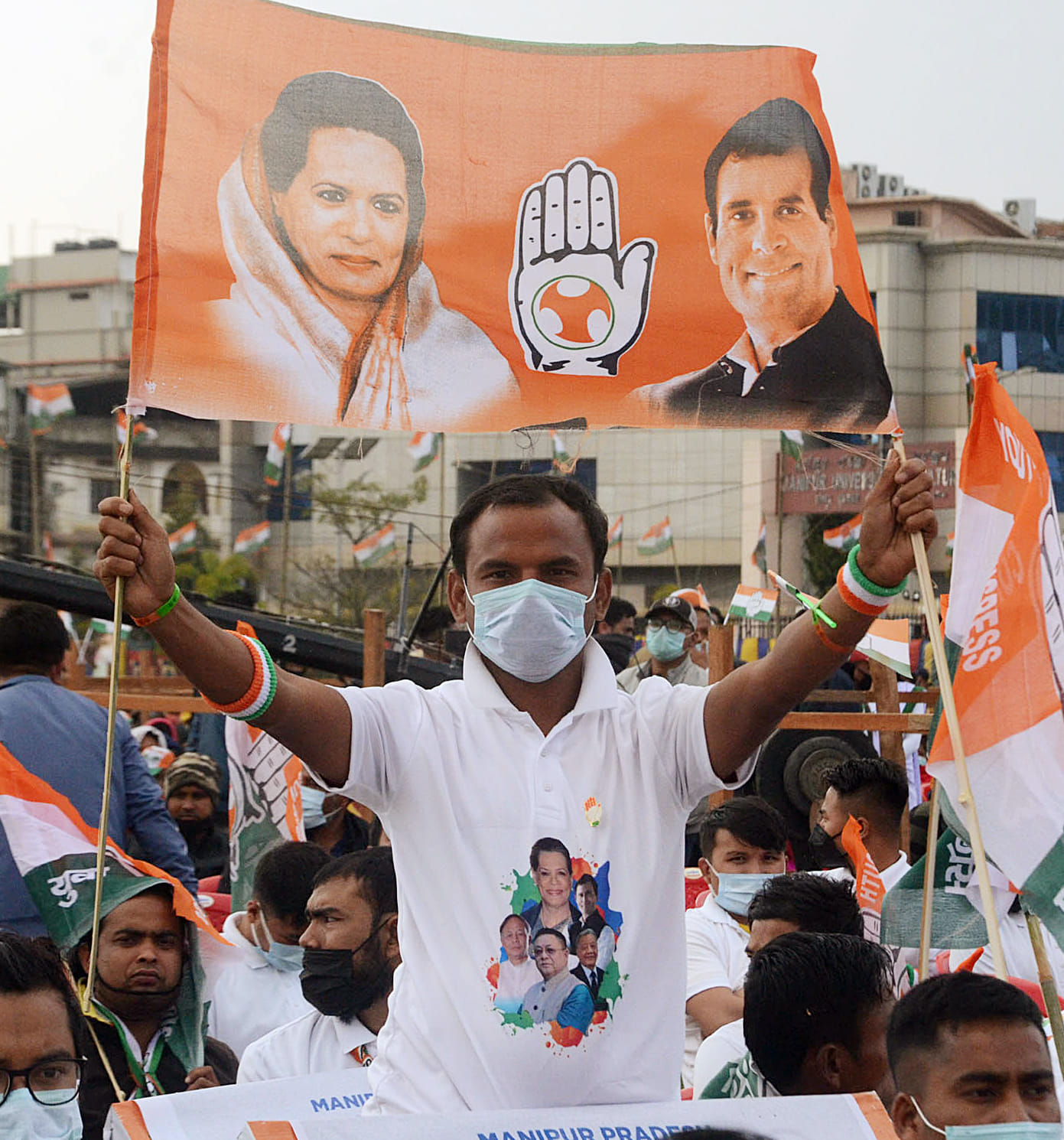 A Manipur Youth Congress supporter holding a party flag during a public meeting addressed by Rahul Gandhi in Imphal on 21 February 2022 | ANI