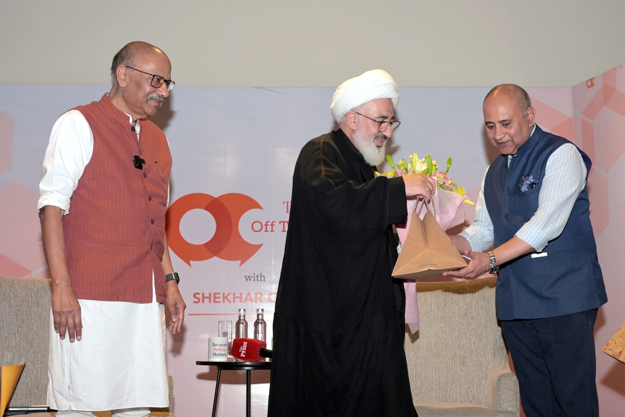 Srikant Peri, COO of the Q Collective, presents bouquet and hamper to Abdul Majid Hakeem Ilahi, Representative of the Supreme Leader of Iran to India, and ThePrint's Editor-in-Chief Shekhar Gupta | Suraj Singh Bisht | ThePrint