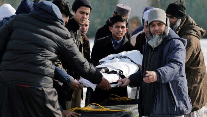 Community members and loved ones carry the body of Nurul Amin Shah Alam, a nearly blind refugee from Myanmar who was missing since his release from a jail into the custody of the U.S. Border Patrol, and who was later found dead, during his funeral service, in Buffalo, New York, U.S., February 26, 2026 | Reuters