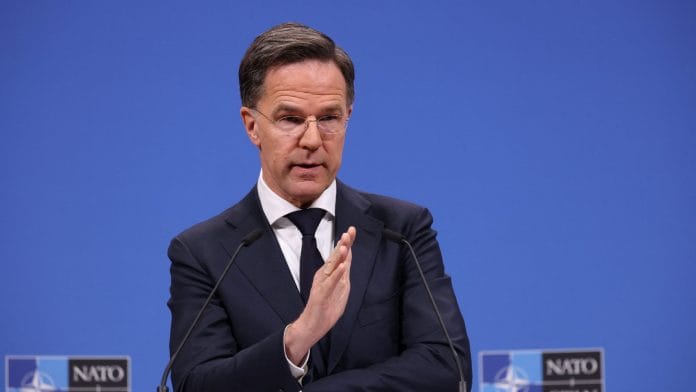 NATO Secretary General Mark Rutte gestures during a press conference to present his 2025 Annual Report, at NATO headquarters in Brussels, Belgium March 26, 2026. | REUTERS/Omar Havana