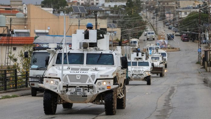 UNIFIL vehicles drive on a main road in Qlayaa, amid escalating hostilities between Israel and Hezbollah, as the U.S.-Israel conflict with Iran continues, in Qlayaa, southern Lebanon, March 27, 2026. | REUTERS/Karamallah Daher