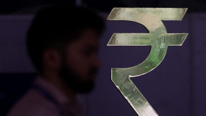A man walks past a Rupee installation at the Reserve Bank Of India (RBI) headquarters in Mumbai, India, April 8, 2026. | REUTERS/Francis Mascarenhas/File Photo