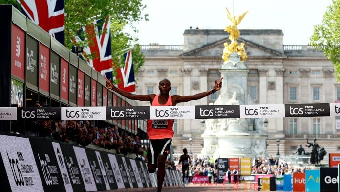 Kenya's Sabastian Sawe crosses the finish line to win the men's elite race | Reuters