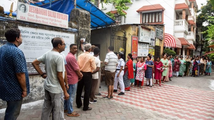 Voters wait in a queue outside a polling station to cast their votes for the second phase of West Bengal Assembly Elections 2026, in Kolkata on Wednesday. | ANI Photo