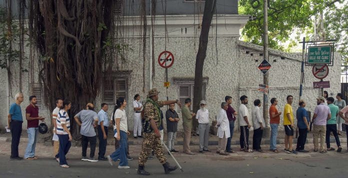 Voters stand in a queue to cast their vote during the second phase of West Bengal Assembly elections 2026, in Kolkata on Wednesday. | ANI Photo