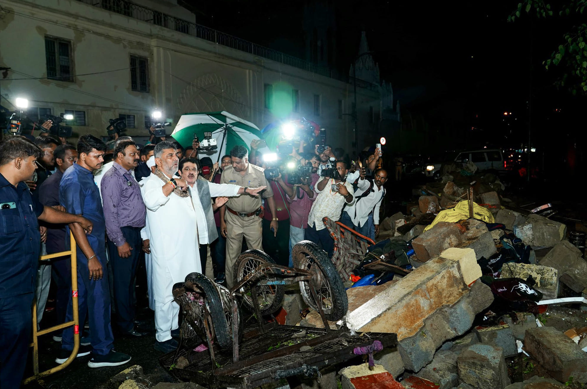 Karnataka Deputy Chief Minister DK Shivakumar visits the site where seven people lost their lives after a compound wall collapsed near Bowring and Lady Curzon Hospital, in Bengaluru on Wednesday | @DKShivakumar X/ANI