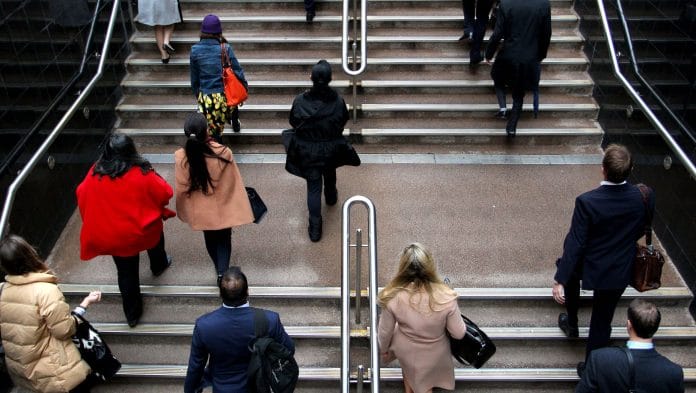 Commuters in the central business district in Sydney. Photographer: Lisa Maree Williams/Bloomberg