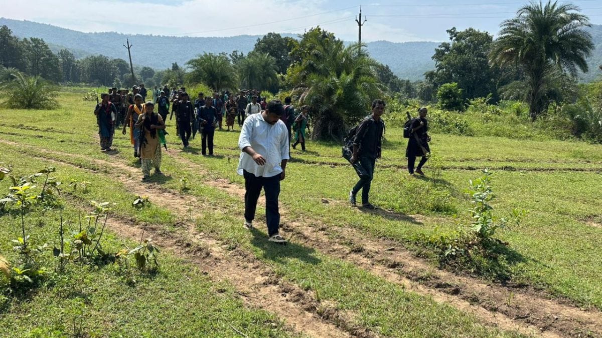 Journalist Ankur Tiwari leads a group of Maoist cadres out of the forests in Bijapur before their surrender | By special arrangement