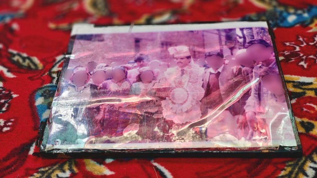 The framed photo of Ali Mohammad Bhat dressed as a groom and surrounded by his friends and relatives | Mahira Khan, ThePrint