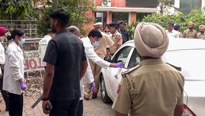 CFSL team and police personnel at the spot, after an explosion outside the BJP office in Chandigarh Wednesday | ANI video grab
