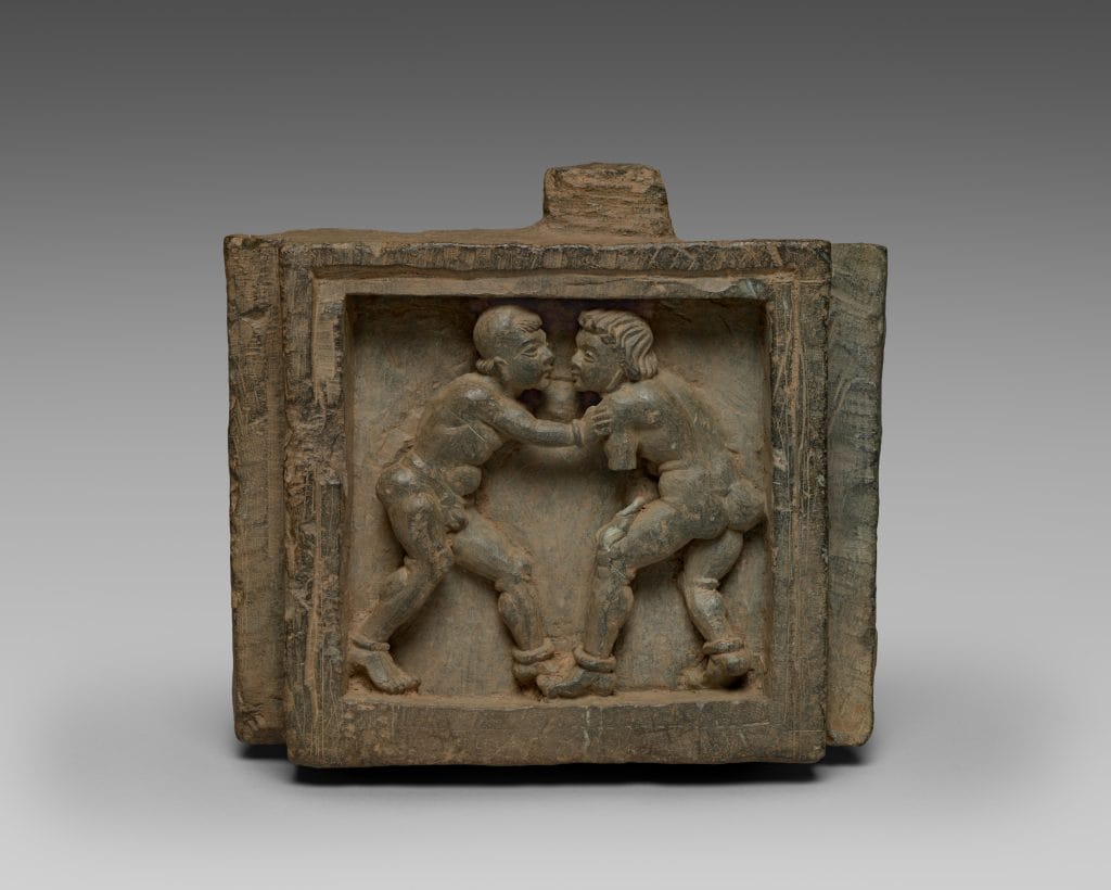 Architectural bracket with wrestlers | Gandhara, Pakistan, 100s-200s CE | Schist, 16 x 20.5 cm | Courtesy Cleveland Museum of Art, Ohio