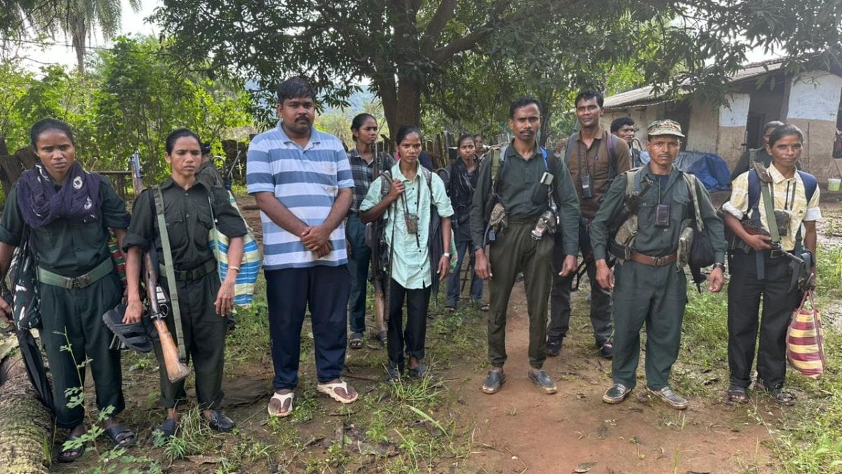 Journalist Ankur Tiwari (in t-shirt) with Maoist cadres before their surrender | By special arrangement