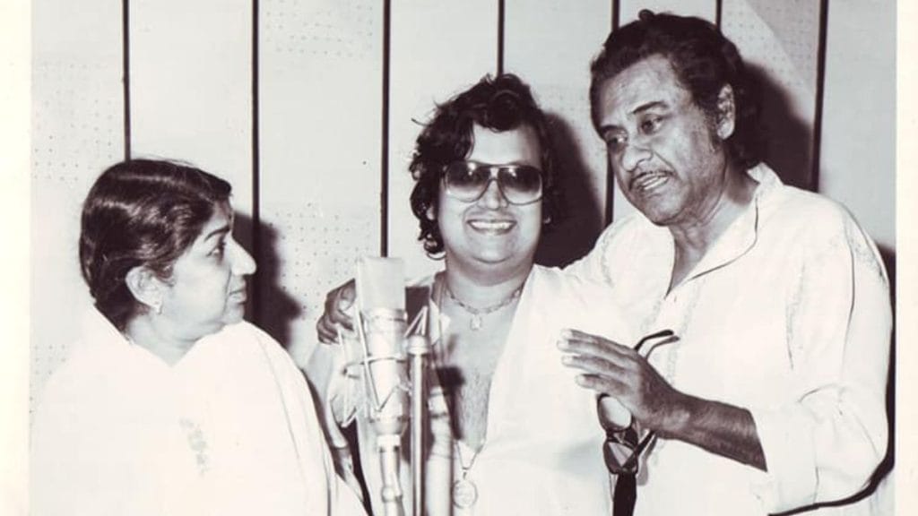 Bappi Lahiri with Lata Mangeshkar and Kishore Kumar. Image: @BappiLahiri/Facebook