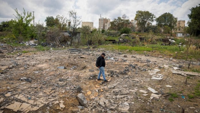 Hussein Saleh, 34, walks on the rubble of his house destroyed in an Israeli airstrike in Tyre, Lebanon on 7 April 2026 | Adnan Abidi/Reuters