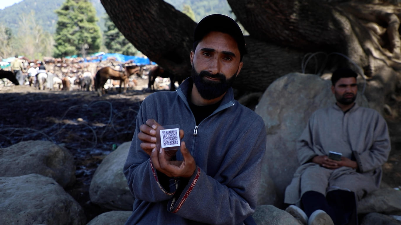 Ponywallah Umar Bashir Wani shows his QR-coded ID card. Ponywallahs like him are yearning for the opening of all tourist spots in Pahalgam. | Mohammad Hammad/ThePrint
