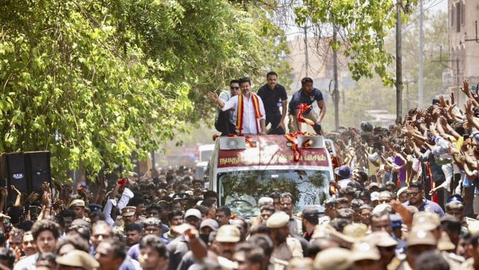 In this image posted on April 2, 2026, Tamilaga Vettri Kazhagam (TVK) chief and candidate from the Tiruchirappalli East constituency, Vijay, during a roadshow en route to filing his nomination for Tamil Nadu Assembly elections, in Tiruchirappalli. | @TVKHQITWingOffl/X via PTI Photo