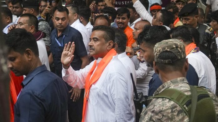 BJP candidate from Nandigram and Bhabanipur Suvendu Adhikari, centre, during a campaign amid the West Bengal Assembly elections, in Kolkata, Monday, April 27, 2026. | PTI Photo/Manvender Vashist Lav