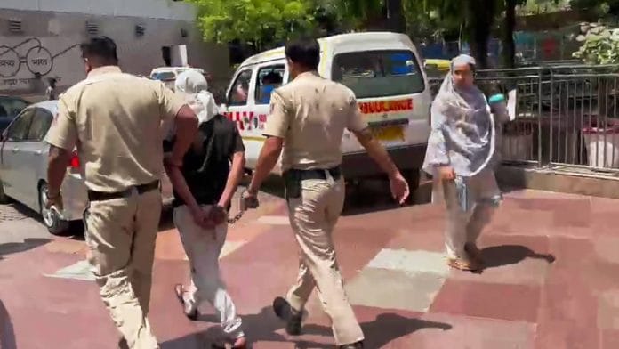 Rahul Meena in police custody Thursday | ANI video grab