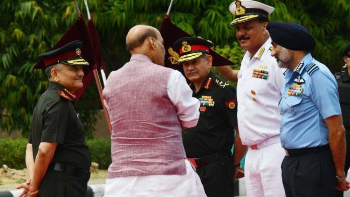File photo of CDS Gen Anil Chauhan, Army chief Gen Upendra Dwivedi, Navy chief Admiral Dinesh Kumar Tripathi, IAF chief Air Chief Marshal AP Singh with Defence Minister Rajnath Singh | Praveen Jain/ThePrint