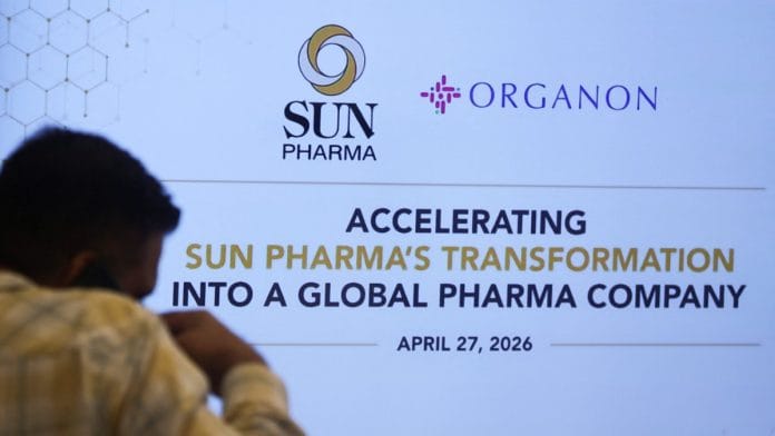 A man walks past a screen during a press conference announcing Sun Pharma's acquisition of Organon in Mumbai, on 27 April 2026 | Francis Mascarenhas/Reuters