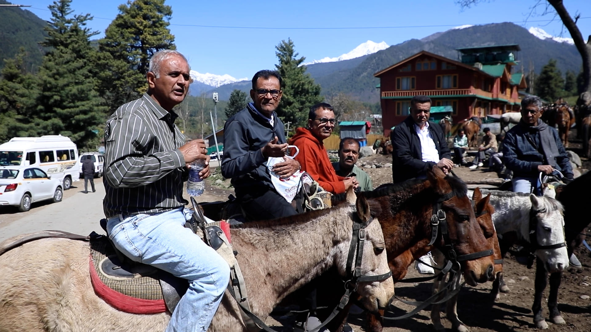 R.N. Choudhary (in orange T-shirt) and his school friends from 1980s taking pony rides in Pahalgam. | Mohammad Hammad/ThePrint
