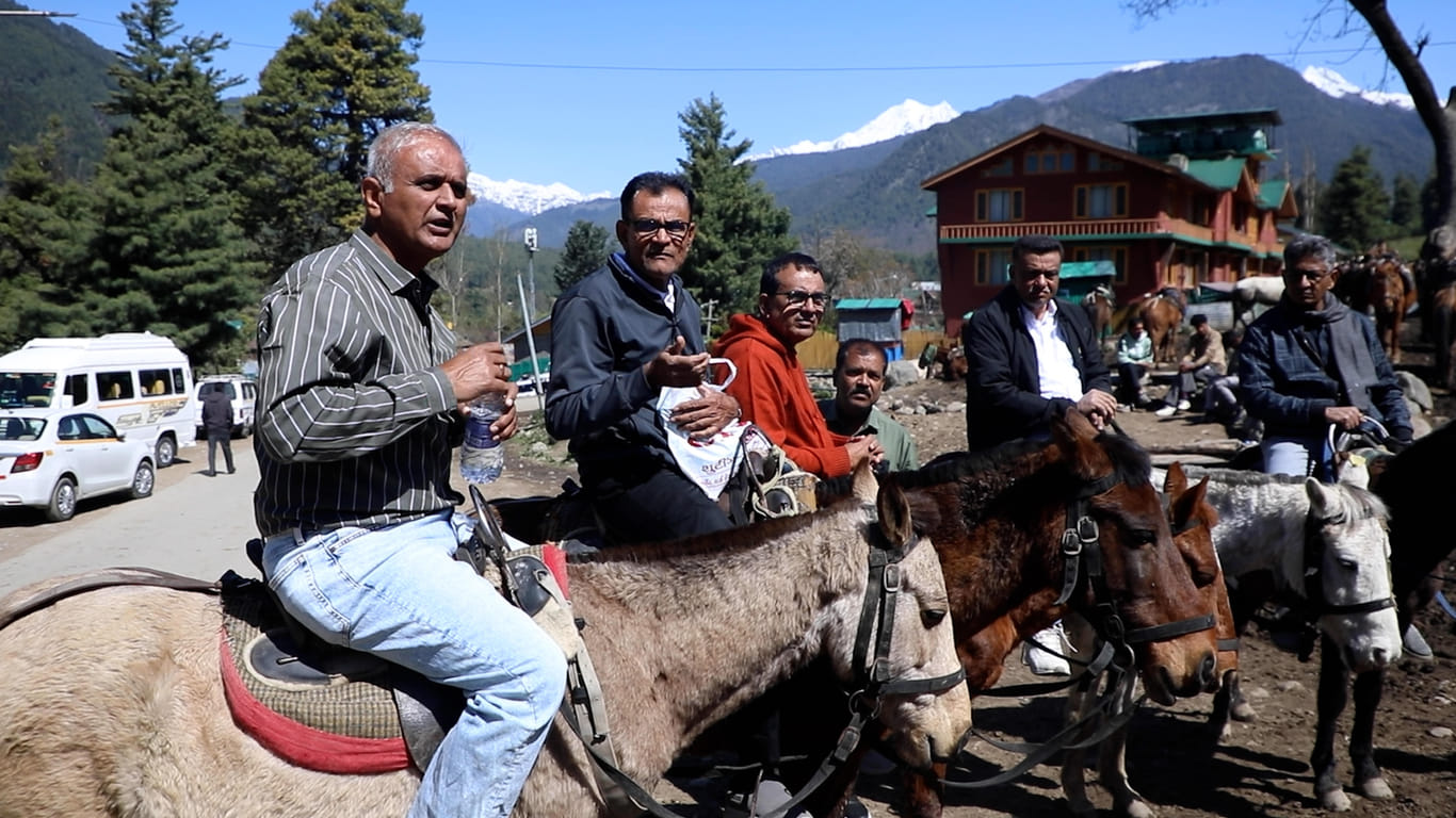 R.N. Choudhary (in orange T-shirt) and his school friends from 1980s taking pony rides in Pahalgam. | Mohammad Hammad/ThePrint