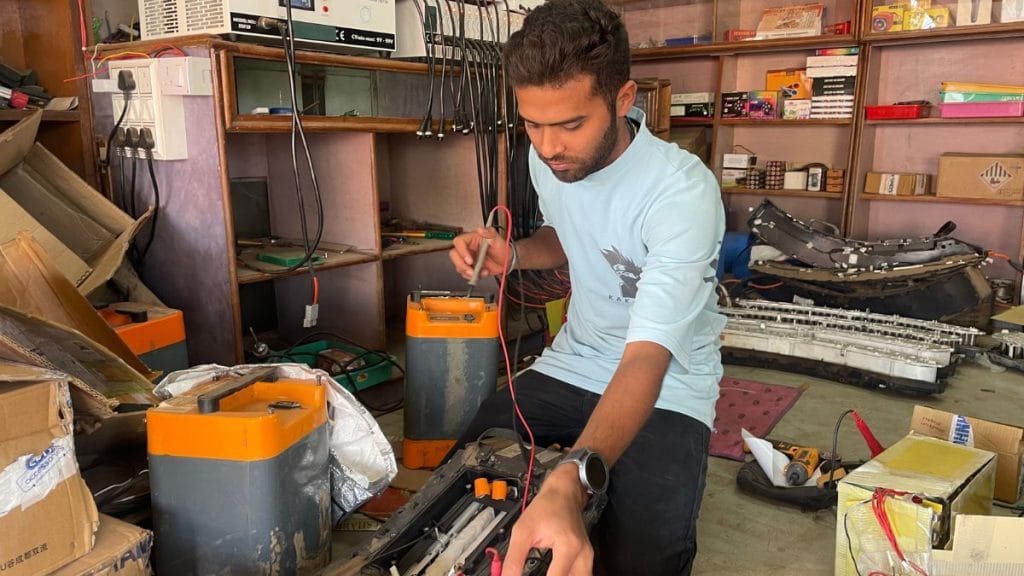 Tikeshwar Verma at work, in his lithium battery and EV repairs shop in the outskirts of the village of Tulsi. Sabah Gurmat | ThePrint