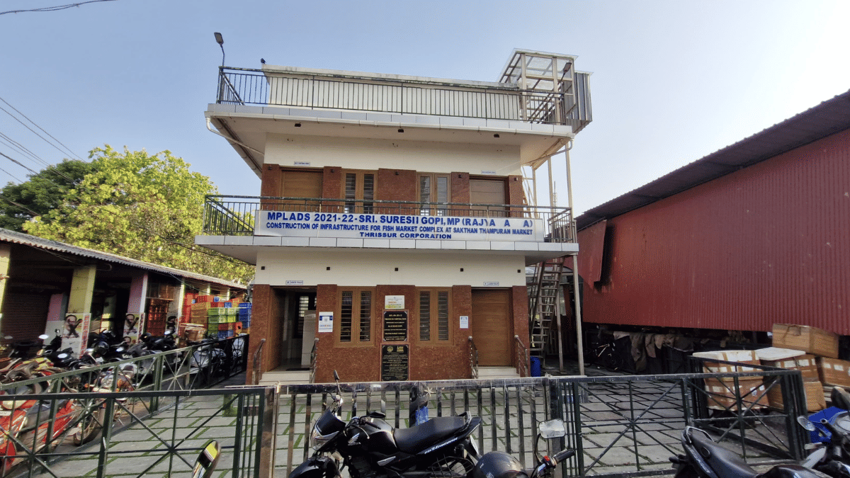 Workers at Thrissur fishmarket point to the two-storied building adjacent to the Thrissur fishmarket when asked about Gopi’s contributions to the city. | Sharan Poovanna/ThePrint