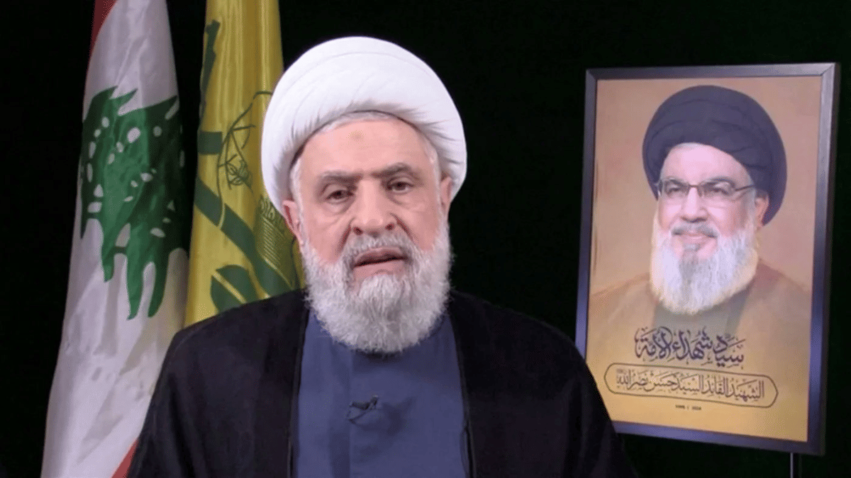 Naim Qassem (in the picture) became Hezbollah’s secretary-general in October 2024. Behind him is the portrait of Hassan Nasrallah, the slain secretary-general of the group | Credit: longwarjournal