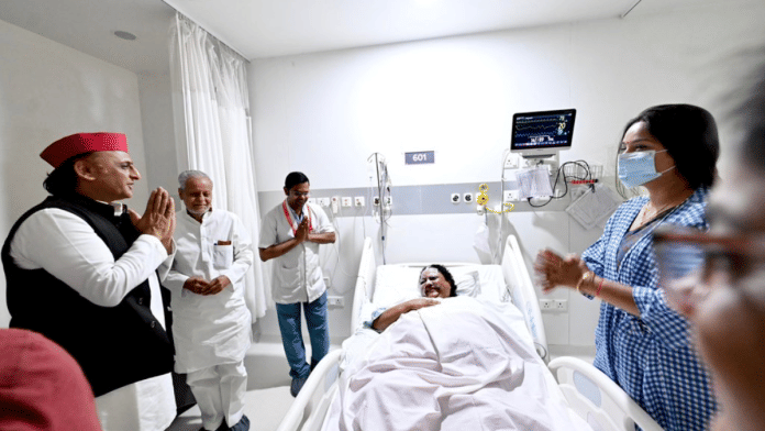 Samajwadi Party president Akhilesh Yadav greets BJP MLA Anupama Jaiswal at the hospital in Lucknow. Senior SP leader Rajendra Chaudhary is standing next to Akhilesh | X/@yadavakhilesh