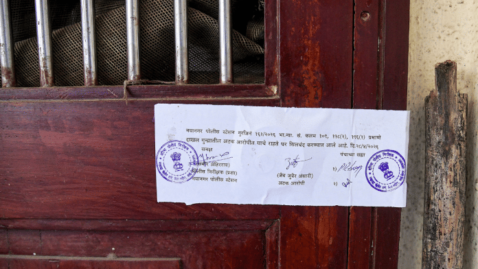 A sealing notice outside the residence of Zaib Zubair Ansari, accused arrested for attacking two security guards in Thane district, in Mumbai's Naya Nagar area | PTI