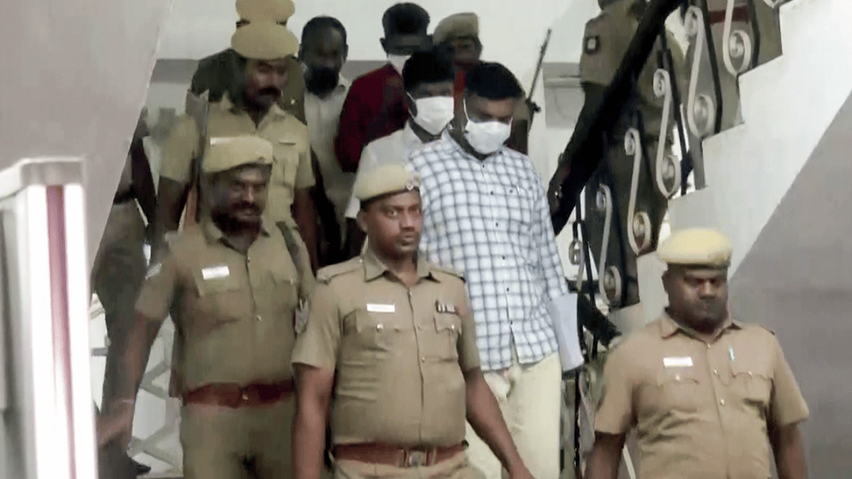 Some of the convicted police personnel (in mask) at the Madurai court. | ANI