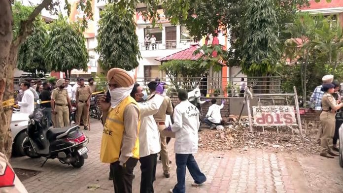 CFSL personnel inspect site after an explosion outside Punjab BJP office, in Chandigarh's Sector 37 Wednesday | ANI