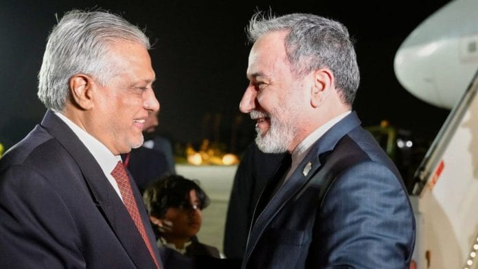 In this photo provided by the Iranian Foreign Ministry, Foreign Minister Abbas Araghchi (right) is welcomed by Pakistani Foreign Minister Ishaq Dar upon his arrival at Nur Khan airbase in Rawalpindi, Pakistan. Stay tuned for live updates | Photo: AP via PTI