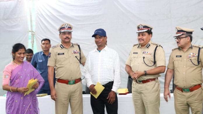 Hemla Iythu (third from left) receives monetary relief from Telangana DGP B. Shivadhar Reddy (second from left). SIB Chief B Sumathi (left), ADG (law and order) Mahesh Bhagwat and ADG (Operation) Anil Kumar accompany the DGP | Photo: By special arrangement