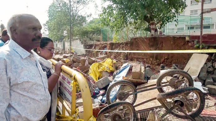 Bengaluru [Karnataka], Apr 30 (ANI): A visual of the remains of the compound wall that collapsed near the Bowring and Lady Curzon Hospital on Wednesday amid heavy rainfall, causing several casualties in Shivajinagar, Bengaluru, on Thursday. (ANI Video Grab)