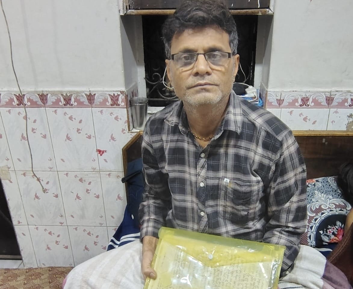 Egg stall owner Shubhash Rathore holds up copies of the complaints he filed after his cart was allegedly destroyed by a Hindu group | Photo: Anushka Srivastava, ThePrint
