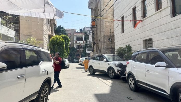 The broad lanes of Preet Vihar lined with cars parked on both sides, leaving little room for movement | Nootan Sharma, ThePrint